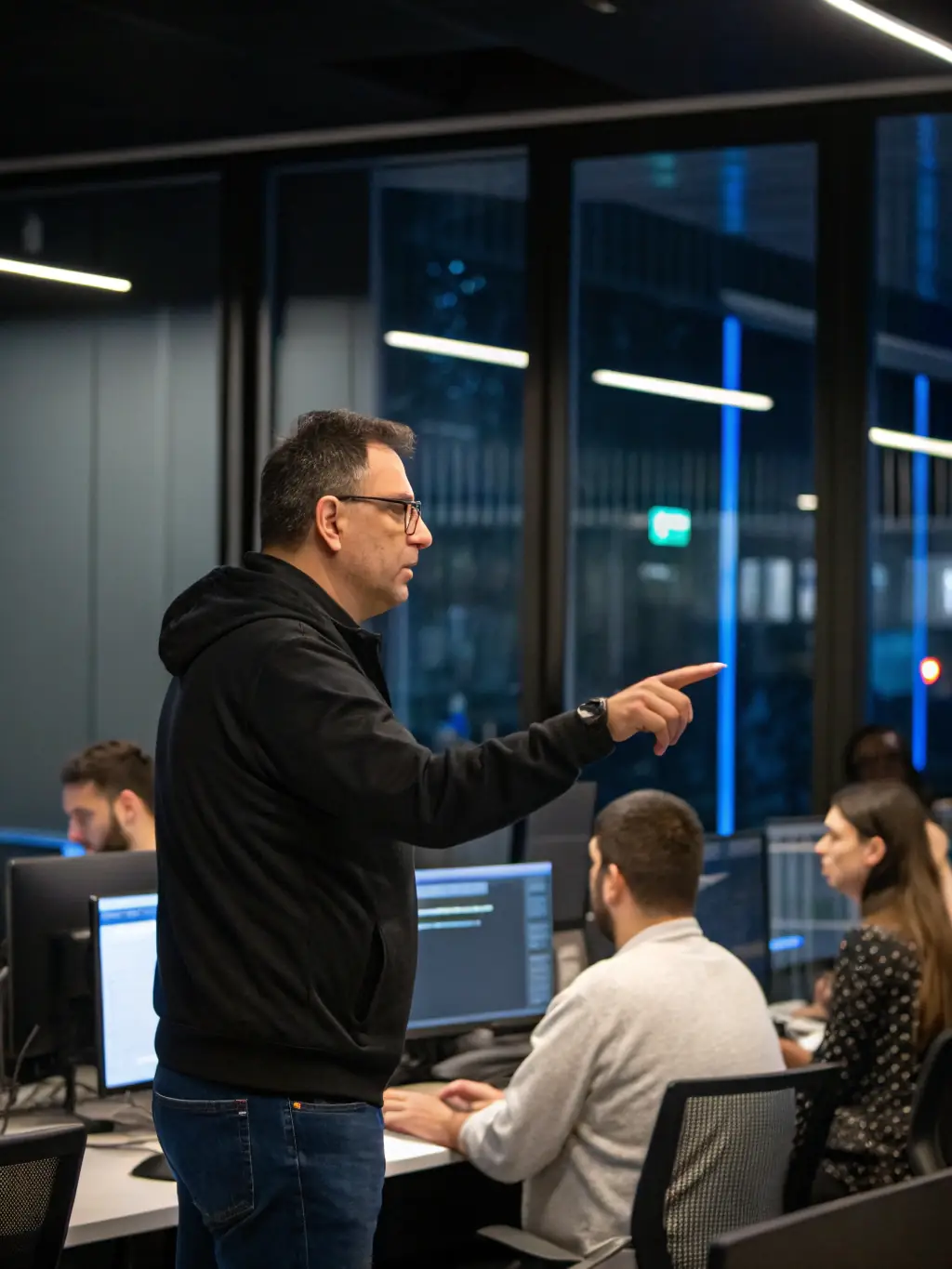 A mentor guiding a group of people in a bright, modern office, symbolizing personalized support and guidance.